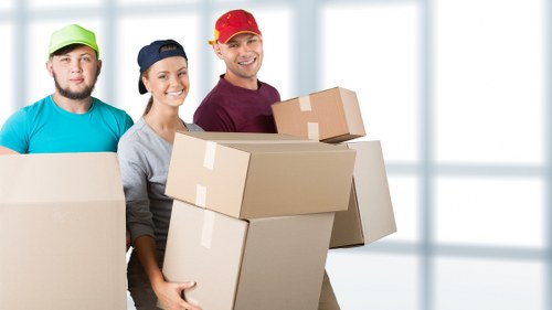 Man and van removals in Streatham with moving van outside residential flats