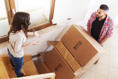 Packed boxes and furniture prepared for a home move in Streatham
