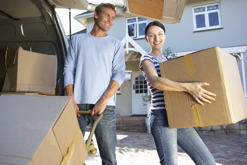 Professional movers loading items from a Streatham flat